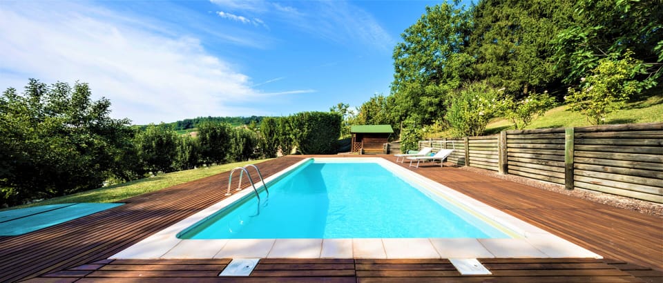 Private pool surrounded by teak wood area