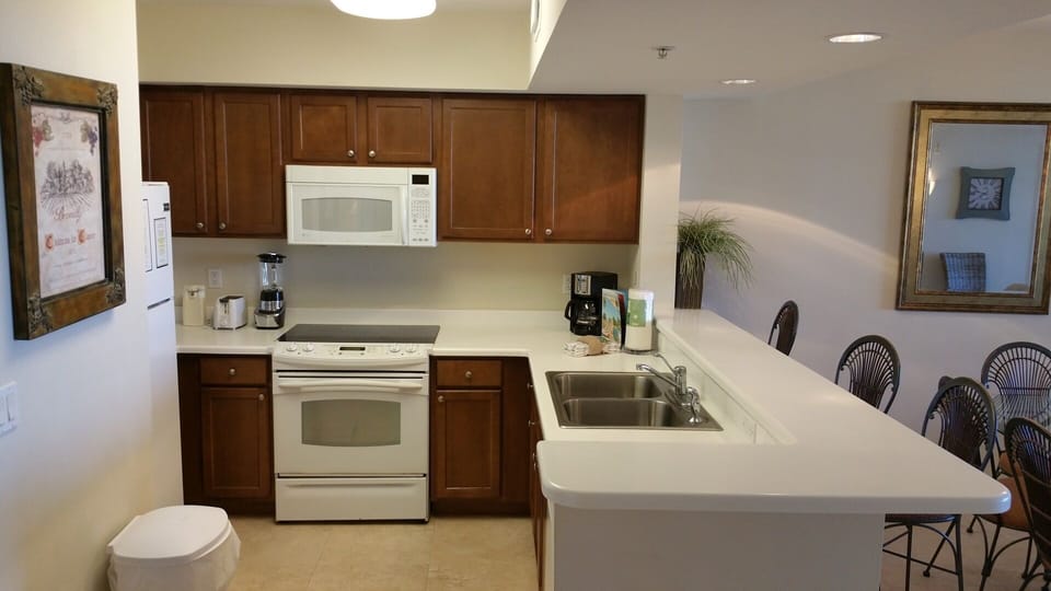 Kitchen close up with 3 bar stools at counter top