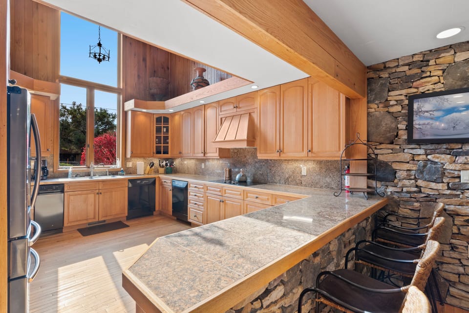 The kitchen also has 2 dishwashers, electric stove, & an oversized refrigerator.