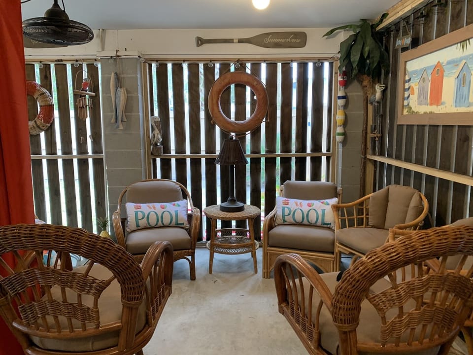 Screen porch area with large TV