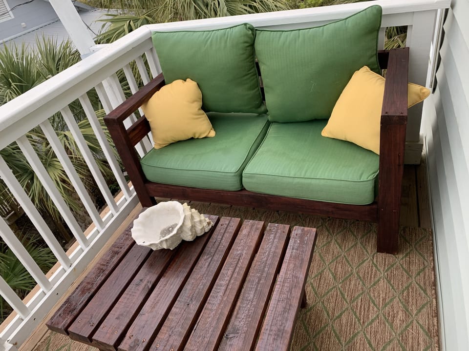 Private covered balcony with seating for 4 off main level (1st floor) bedroom