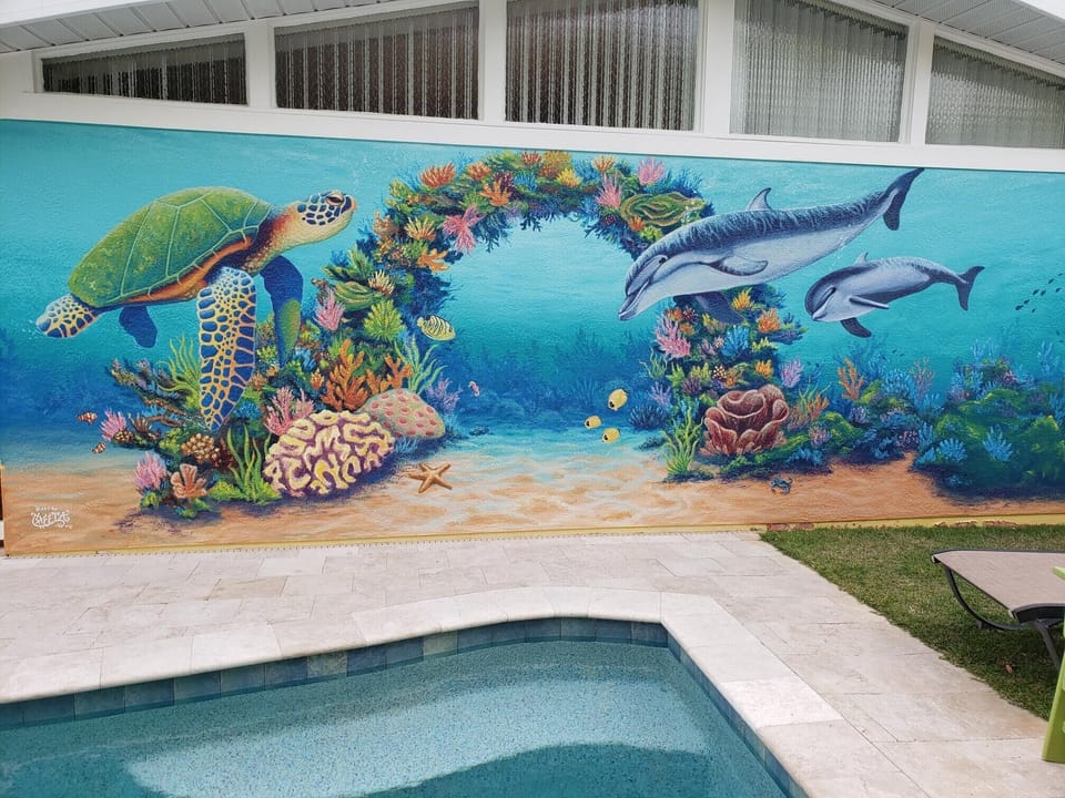 Our hand painted mural done by local artist Cheeta.