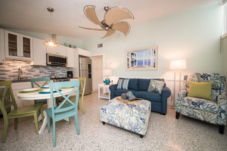 Living room with dining table & kitchen. All new SS appliances.