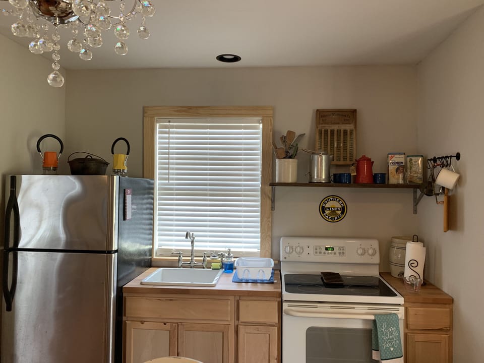 Full kitchen with fridge, stove, and microwave 