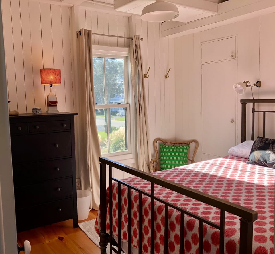 Full-size antique brass bed in downstairs BR.