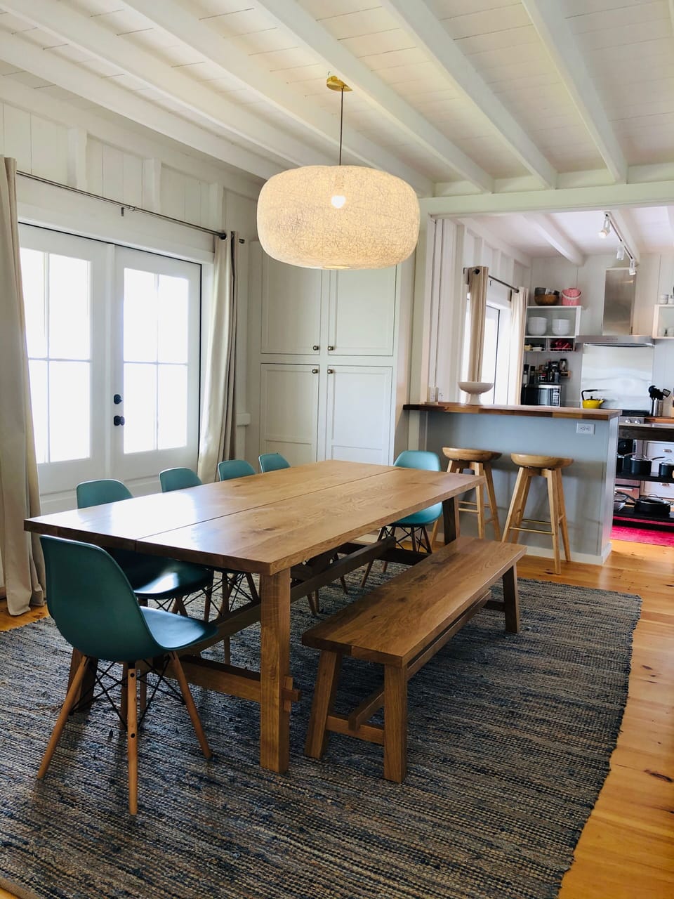 Large dining table.  Additional seating at bar/island & outside.