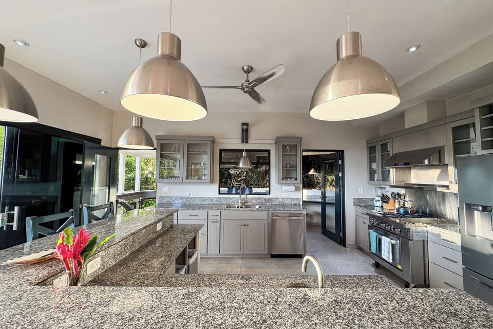 Modern gourmet kitchen with ample space, island seating (6) , and top-tier tools