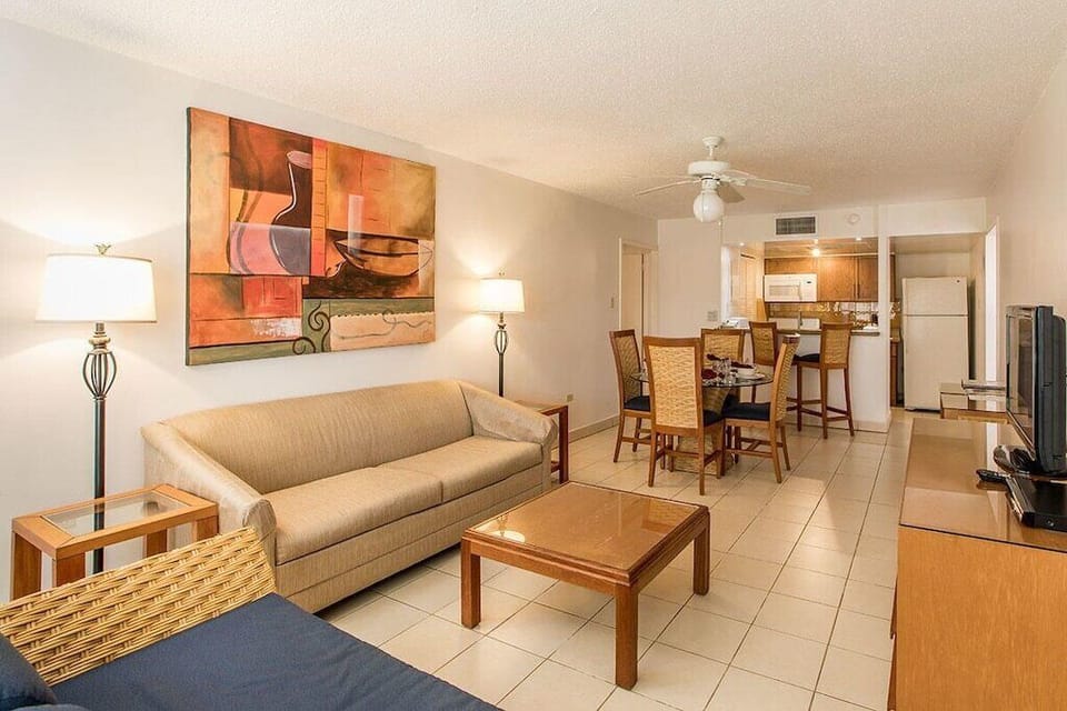 THE COMMON AREA BOASTS A FULL KITCHEN, LIVING ROOM & DINING ROOM AREA & BALCONY.