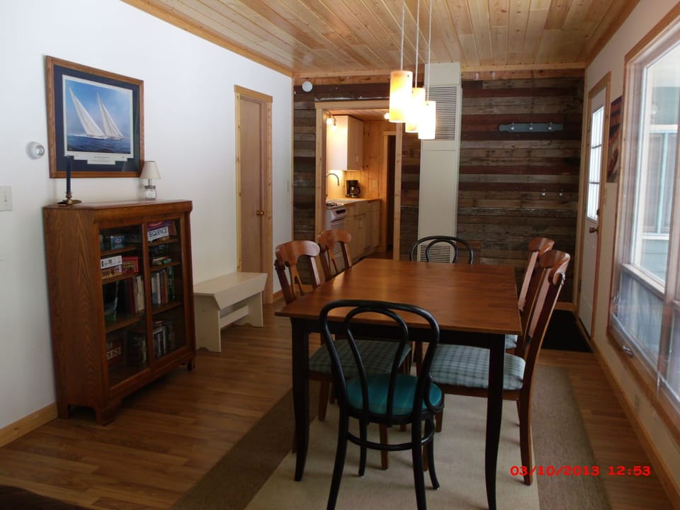 Dining Room - big window with lake view, room for games. Window a/c for hot days