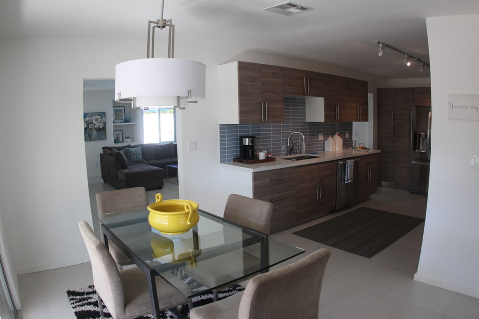 Kitchen is in the center of TWO living rooms and TWO dining areas..very open!