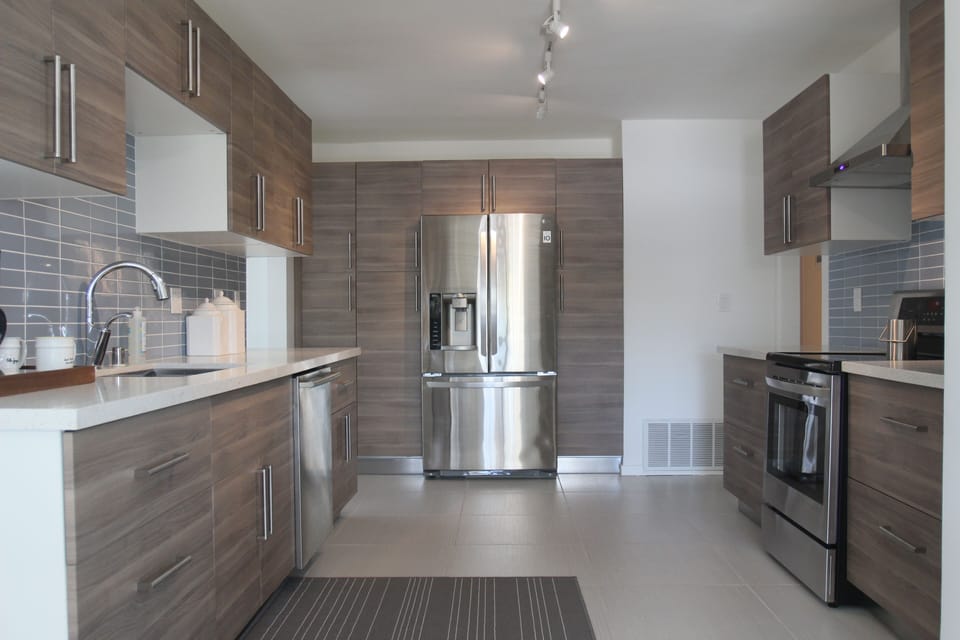Newly remodeled modern kitchen with all stainless LG appliances.