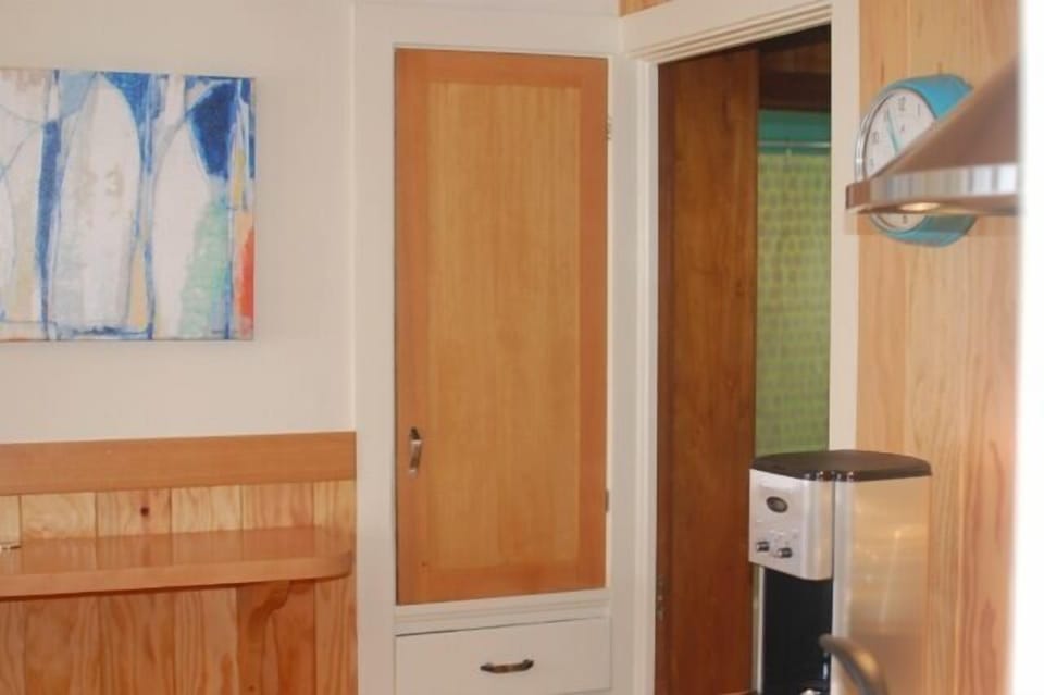 Kitchen is fully appointed with small appliances and cooking gear.