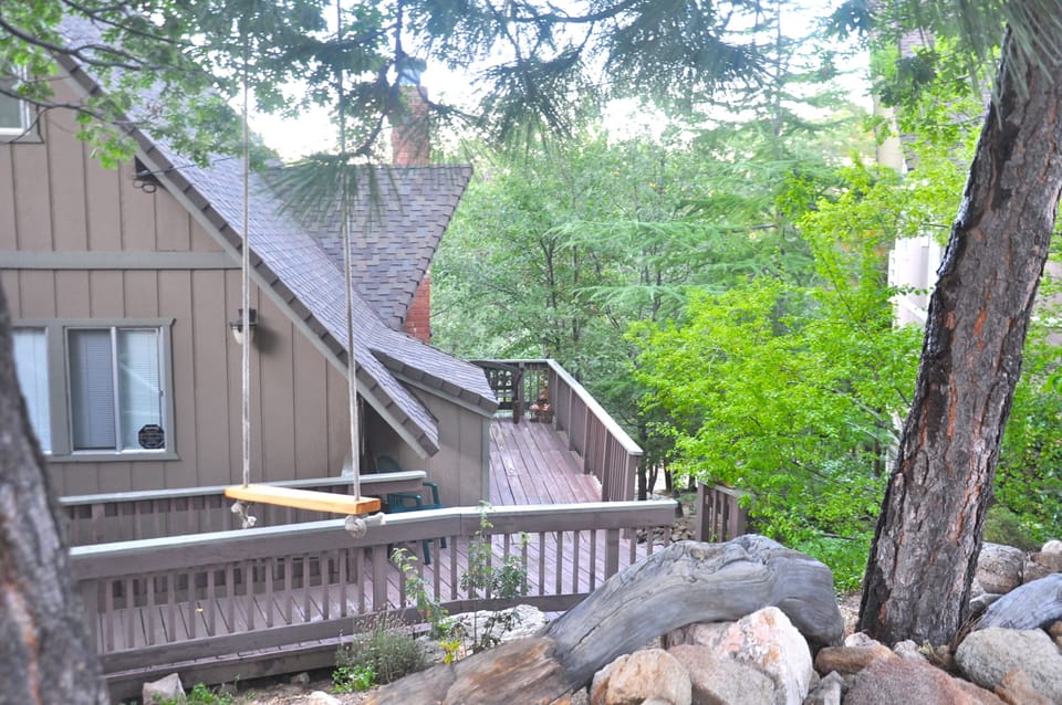 Front entry deck and a swing for the kiddos. 