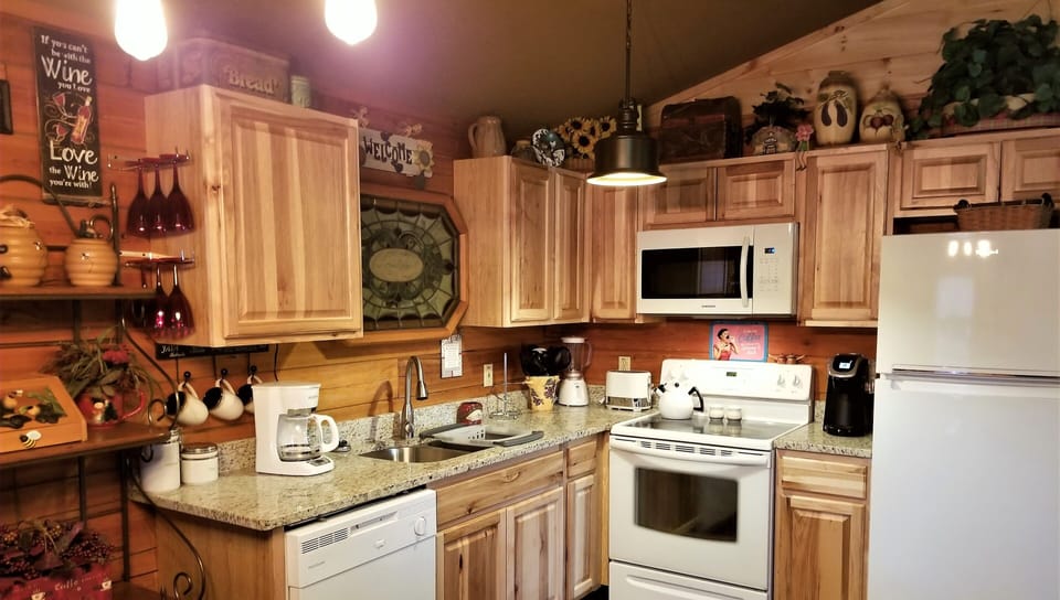 The kitchen has everything to prepare meals-new appliances & granite countertops