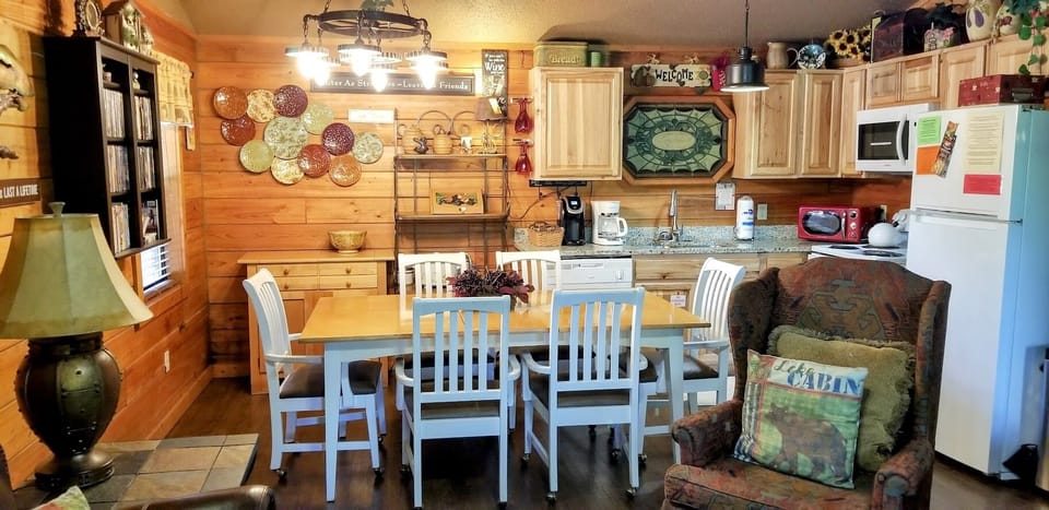 The large dining table has pleanty of space for everyone to enjoy meals