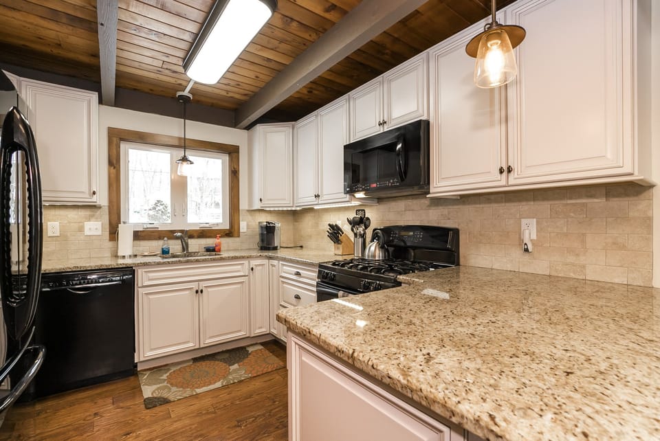 Modern Kitchen, with bar seating and table seating.
