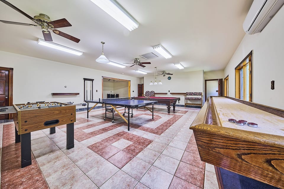 Game room with table tennis, pool table, foosball and shuffleboard