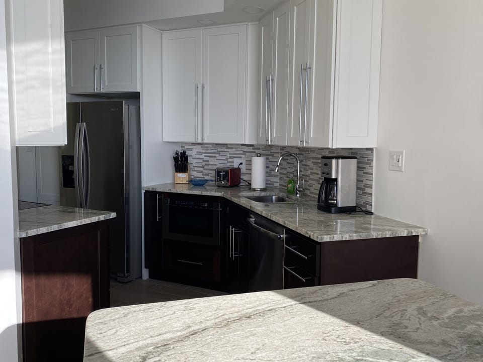 Totally new high grade appliances, dishware and granite surfaces.  
