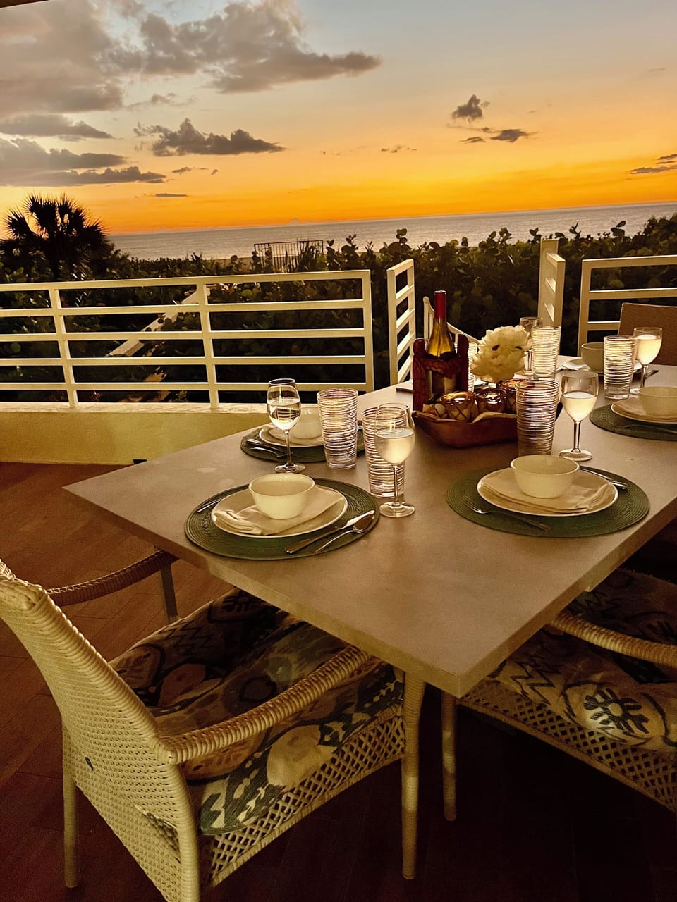 Beachfront Lanai with dining, staircase to private cabana, pool, and beach