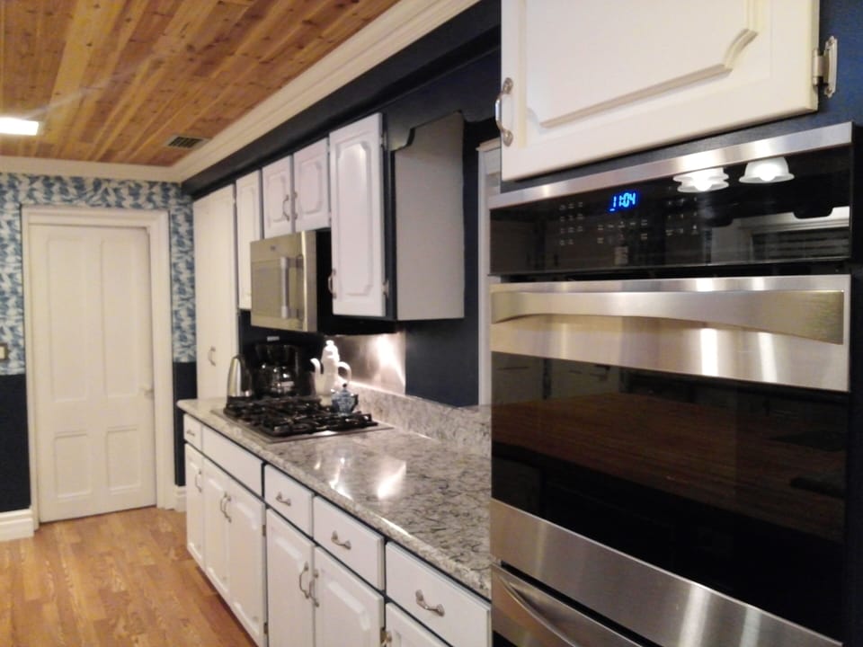 Quartz counter tops - high end appliances - folks love this huge kitchen.