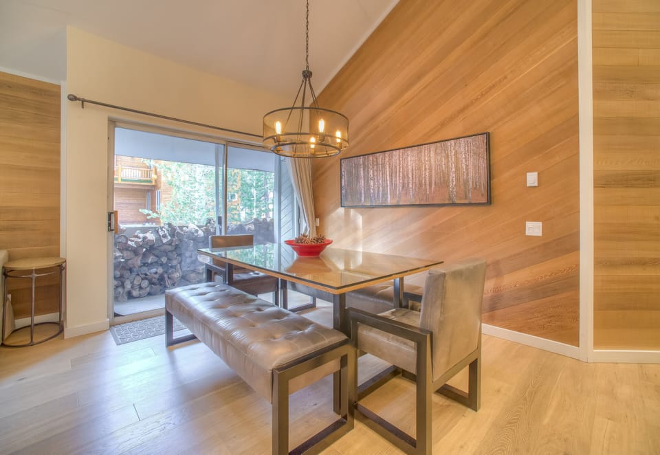 Custom dining table with bench seating comfortably accommodates a crowd.