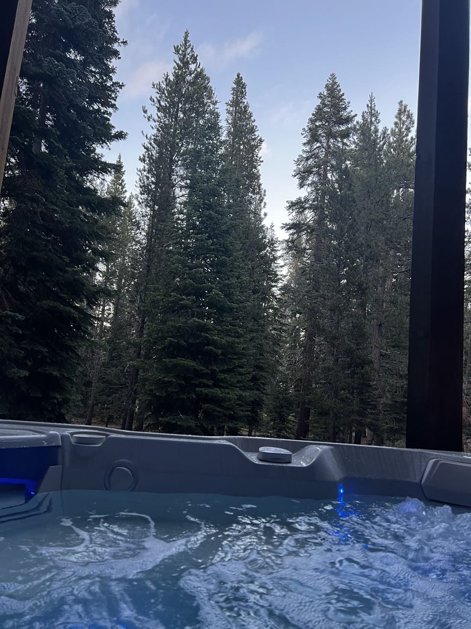 Private hot tub under deck - back of house looking toward green belt 