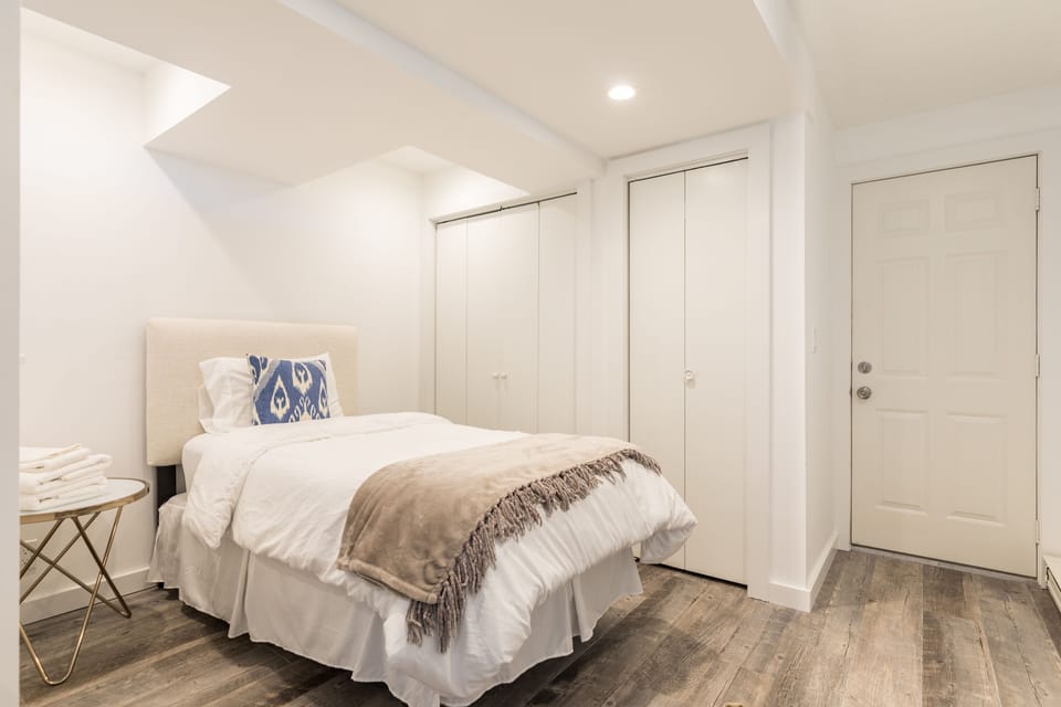 Extra bed tucked away in the corner.