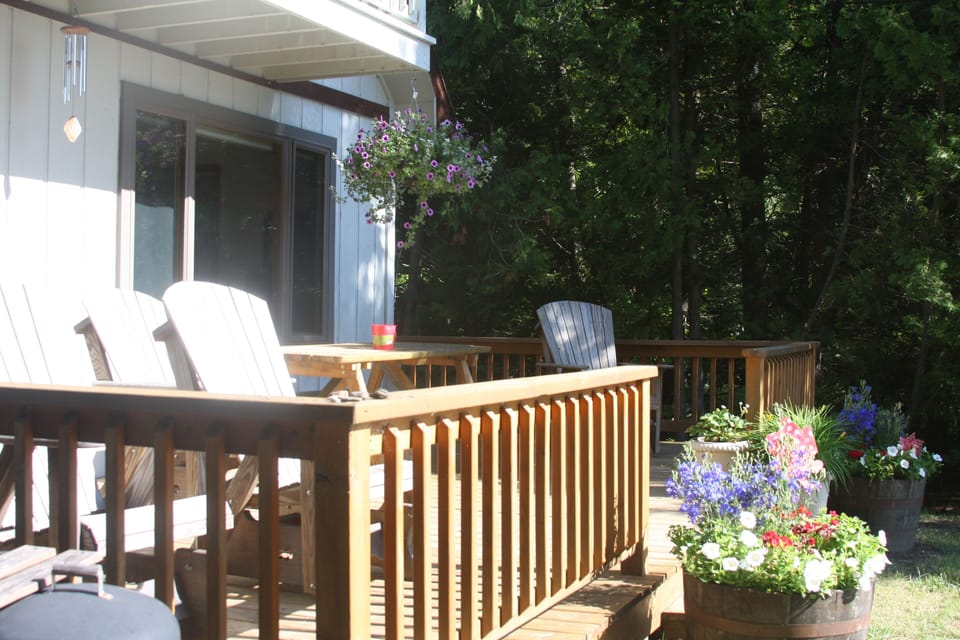 large deck with large table facing the lake