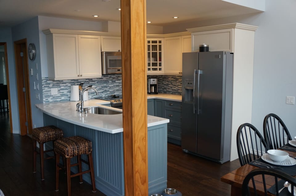 Kitchen with bar stools. 
