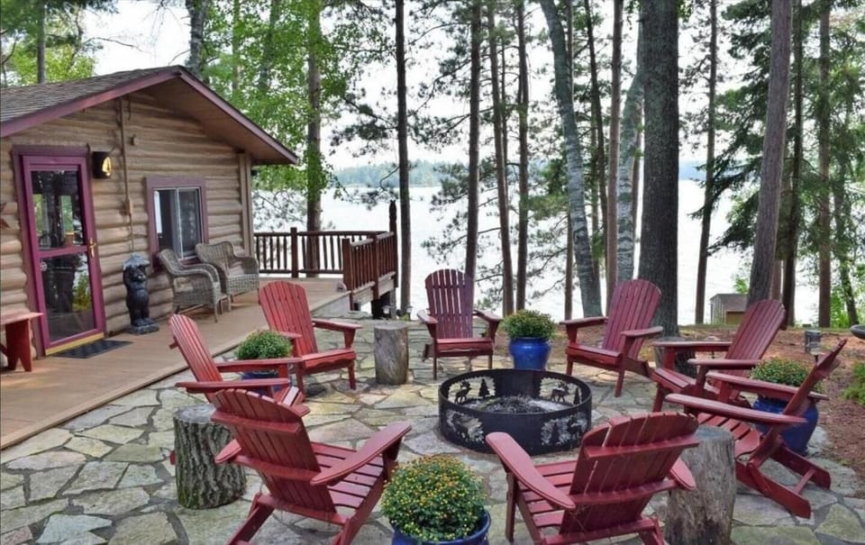 Fire Pit Over Looking Lake and Large Pines with Grilling Area