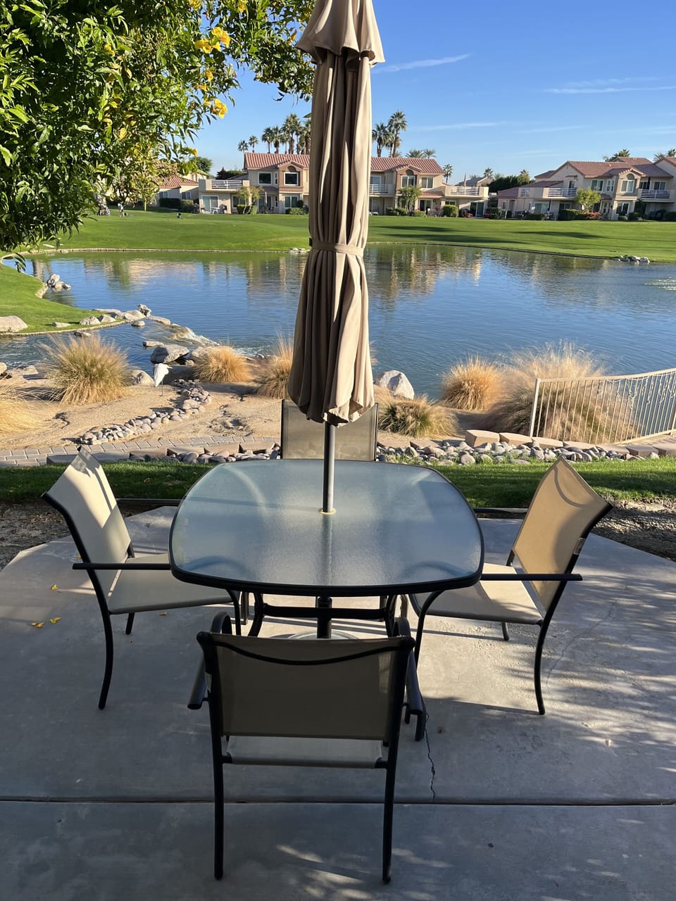 Patio /w amazing views. There’s a table, umbrella, chairs and BBQ