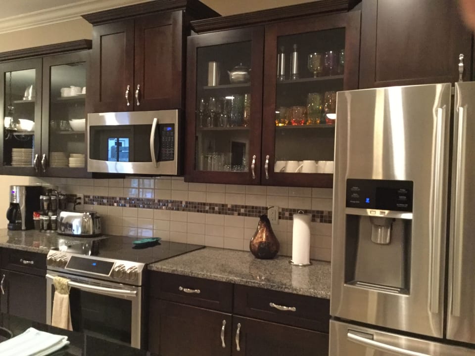 FULLY EQUIPPED KITCHEN W/ISLAND SEATING PANTRY, KITCHEN SUPPLIES LIKE SOAP ETC.