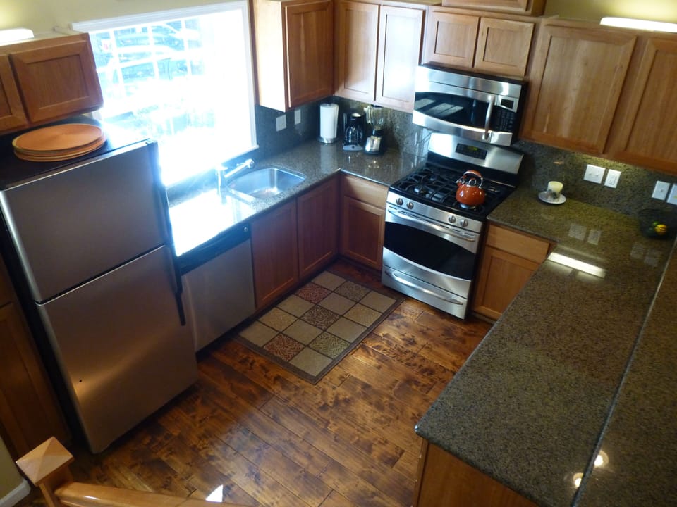 Granite counters, loads of dishes, flatware, & cooking supplies