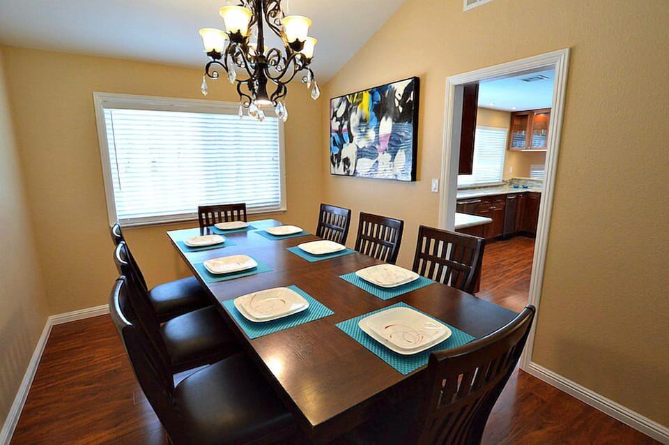 Dining room with expandable table accommodating 12 adults