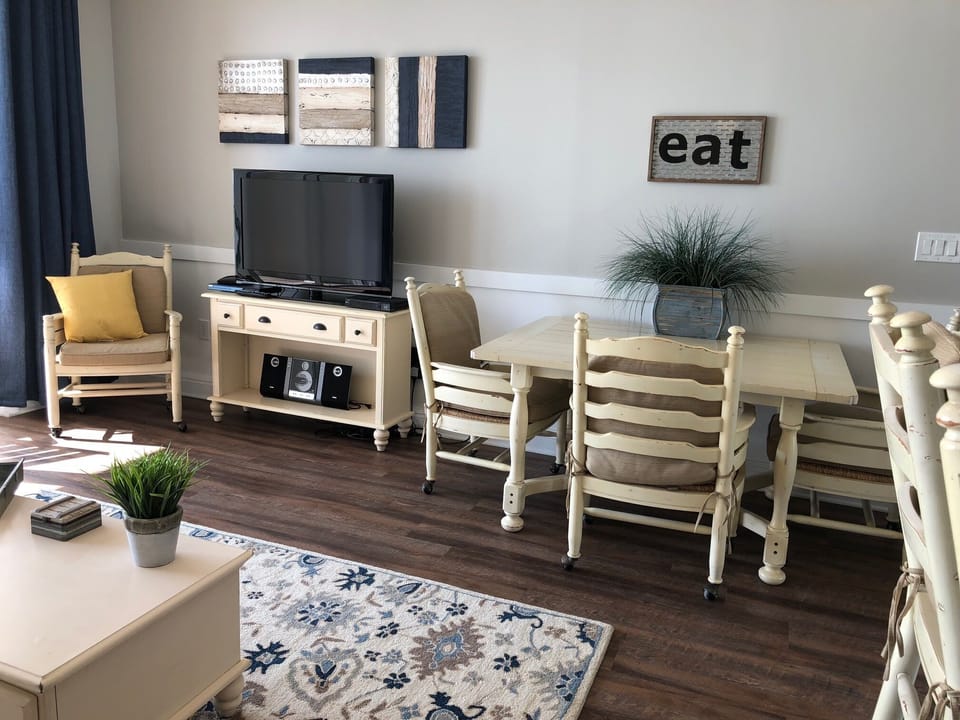 Dining area adjacent to living room and kitchen. 