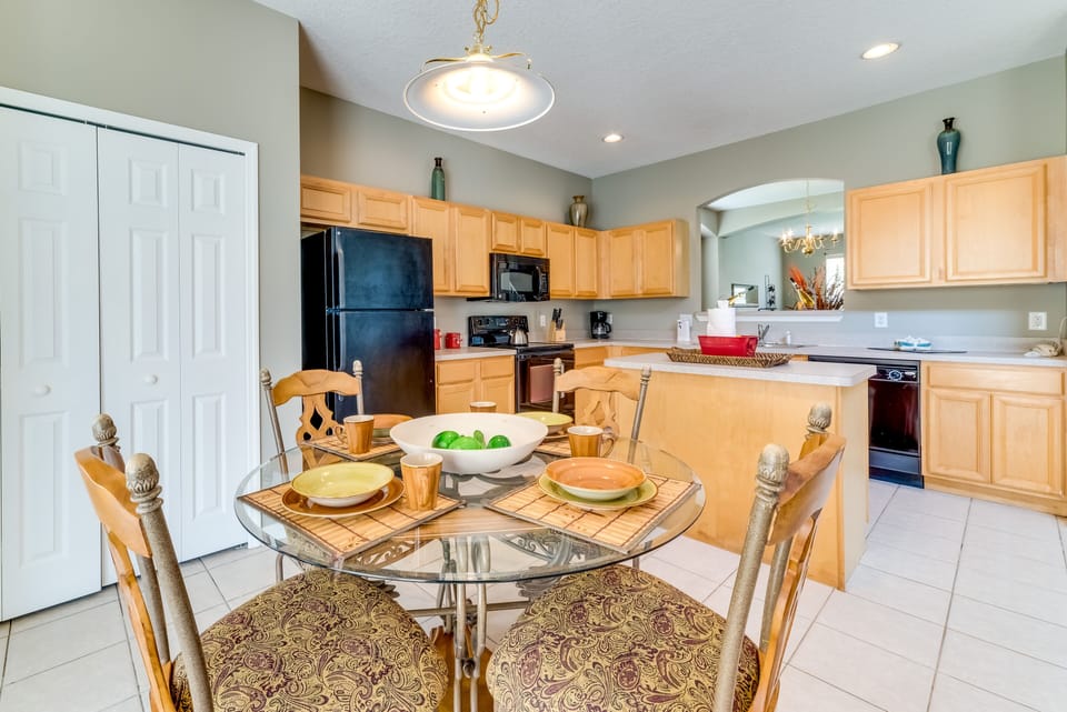 Large open kitchen with pots and pans