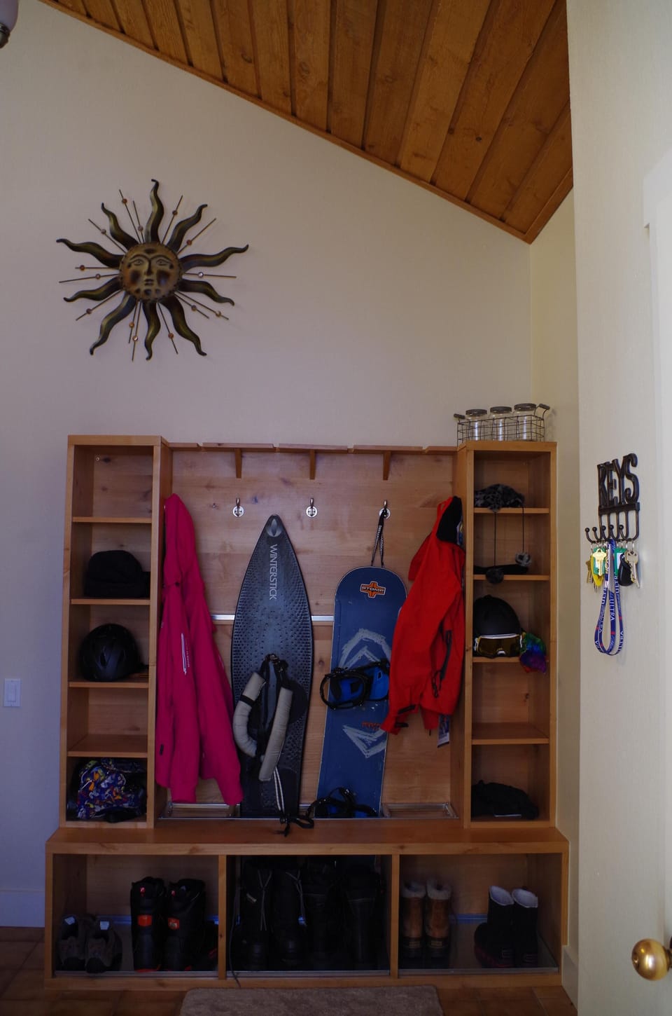 Entry Way with custom ski/snowboard/gear rack.