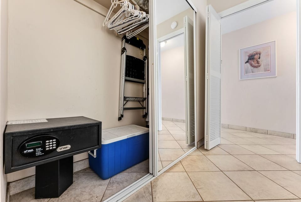 Master bedroom closet with digital security safe.