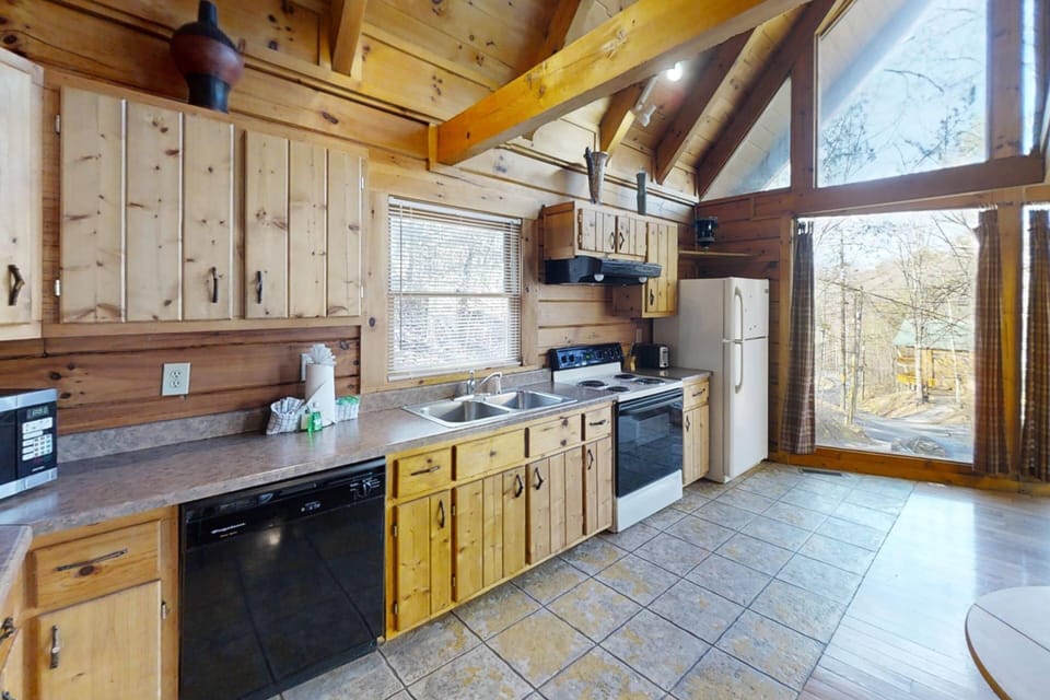 The kitchen at Highlander offers plenty of counter space, all your standard appliances, and basics for preparing meals.
