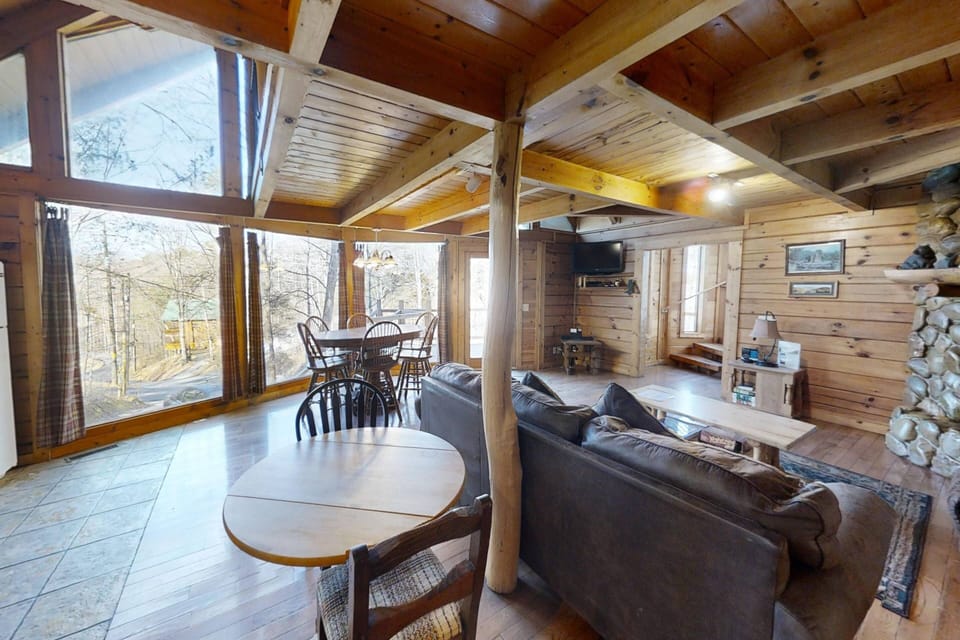 Once inside, you're welcomed with huge windows and all the accents of a Smoky Mountain cabin!