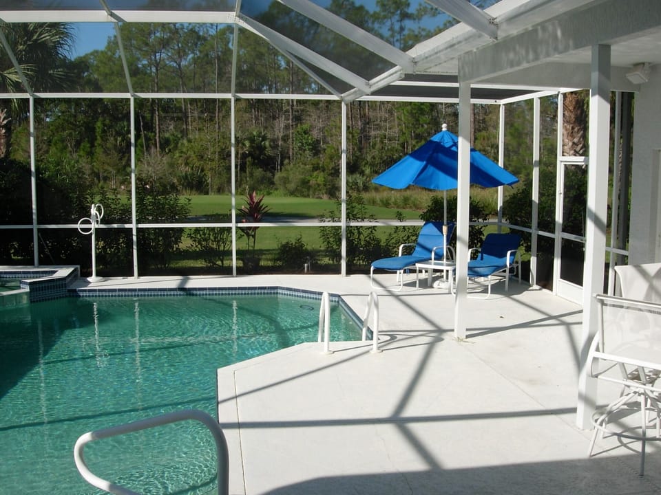 Screened Lanai with Pool, Lounge Chairs and 2 Outdoor Eating Areas 