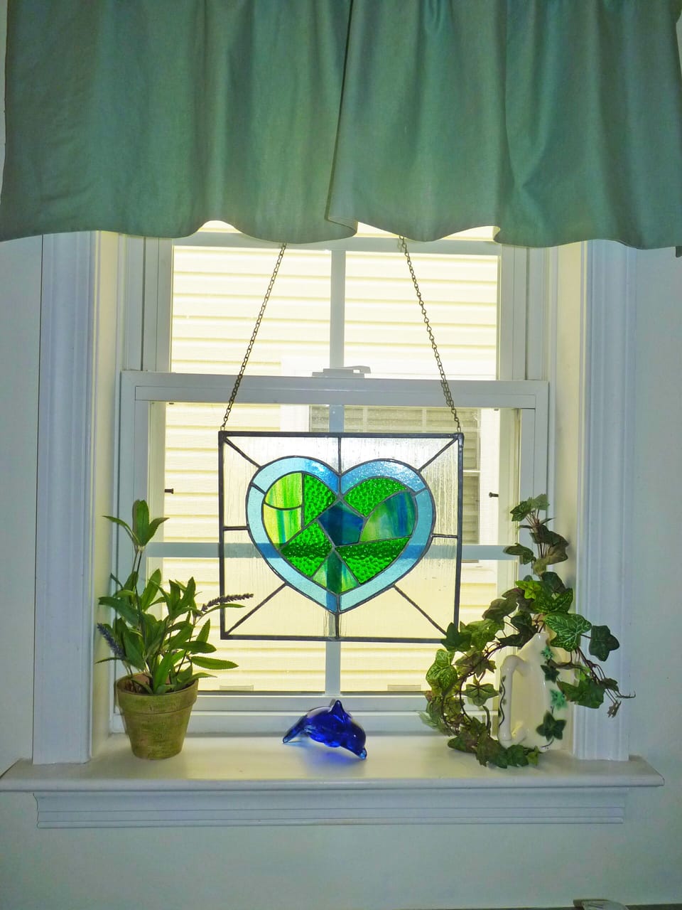 Beautiful kitchen window with hand-made stained glass by owner