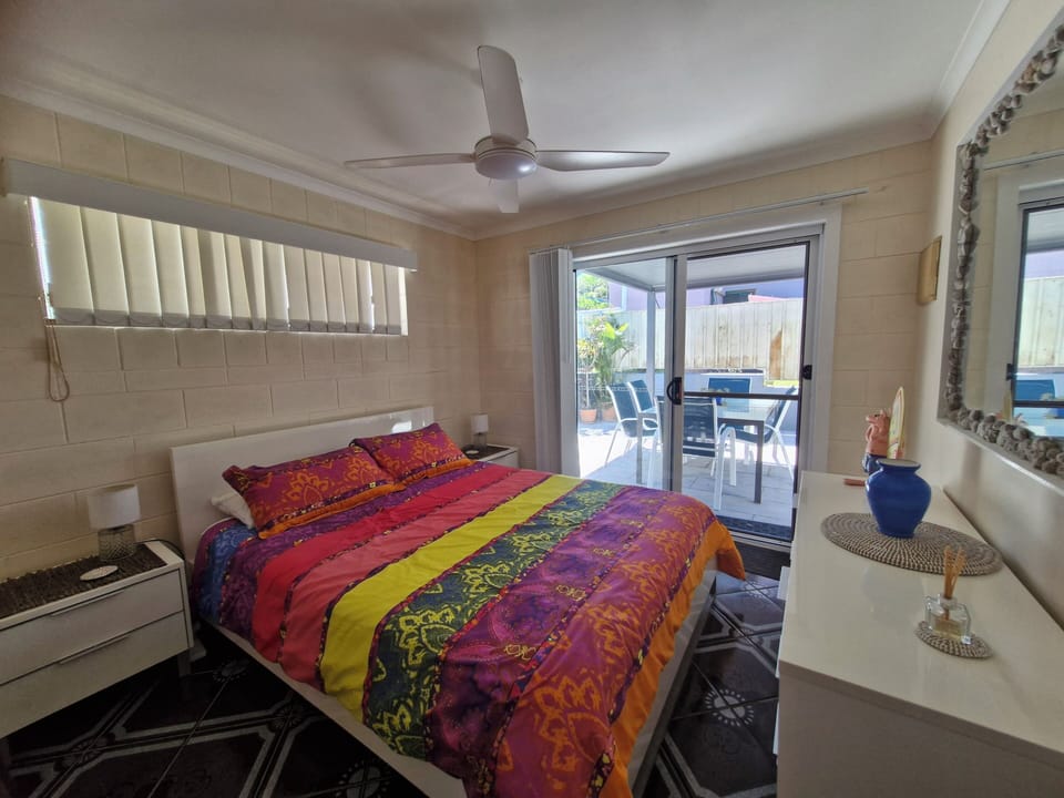 Bedroom1. Ceiling fan,bed lamps and clothes storage.