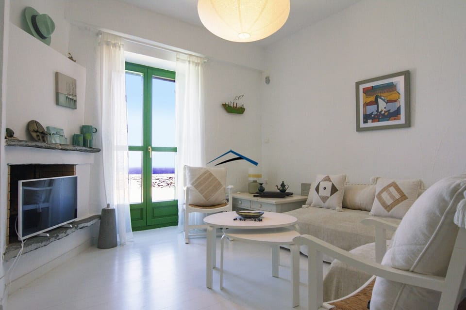 The living room with a pool and sea view