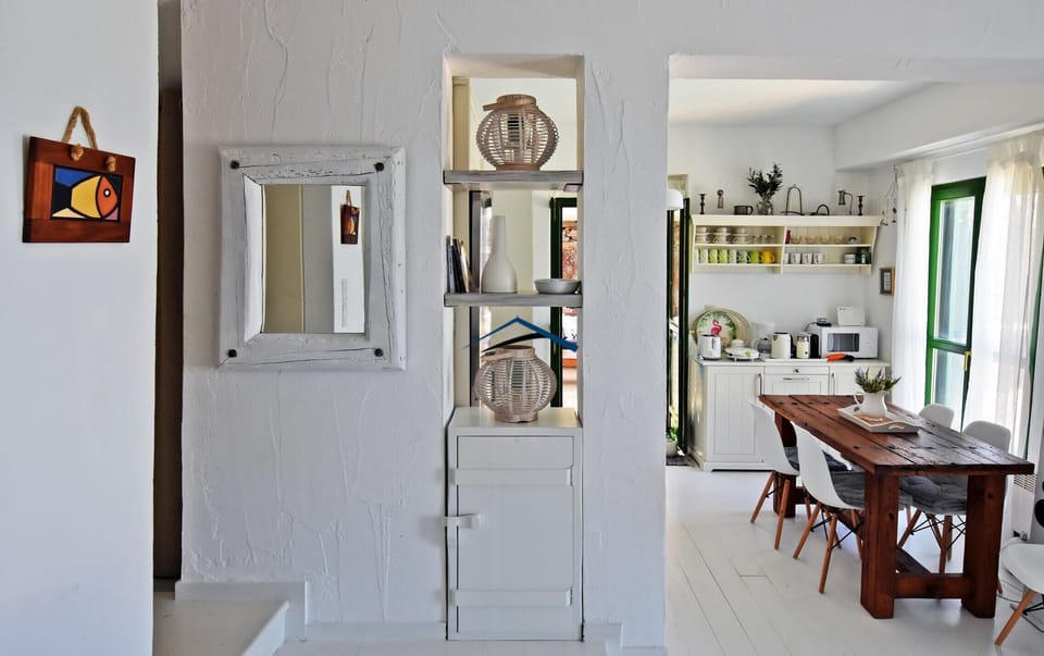 a view of the kitchen and indoor dining area