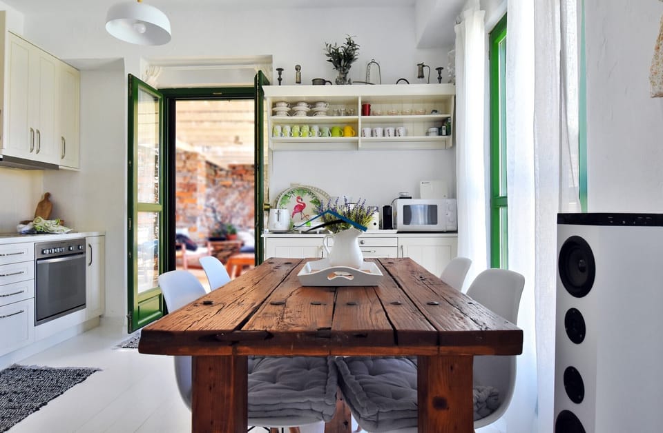 The indoor dining area and the kitchen