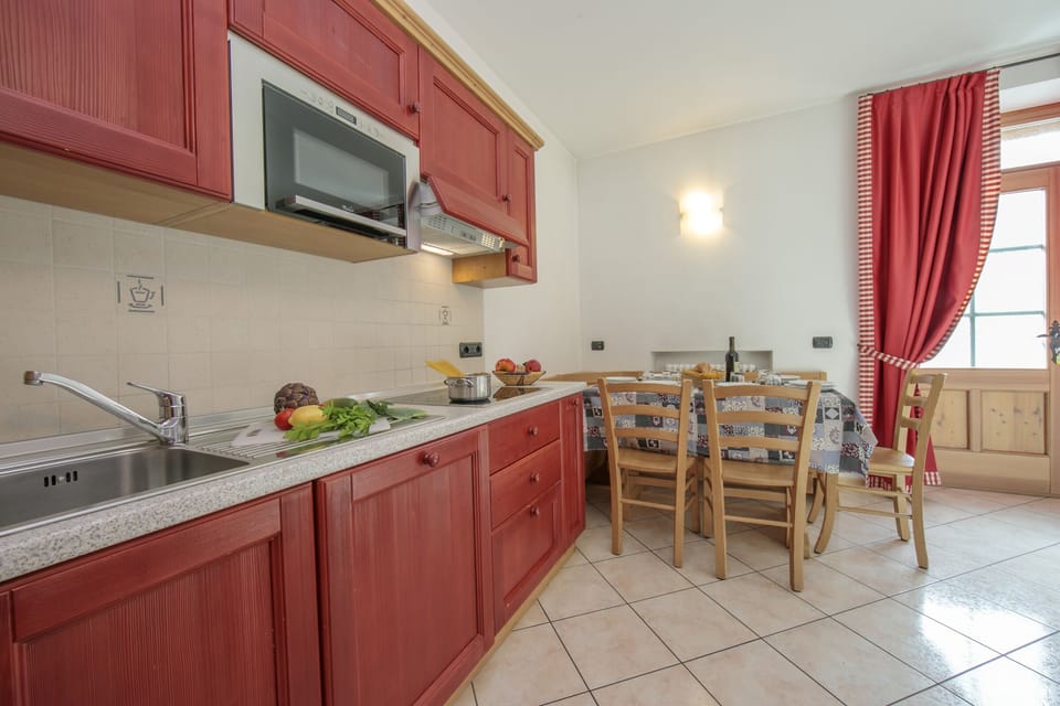 Modern fully equipped kitchen with a dining set