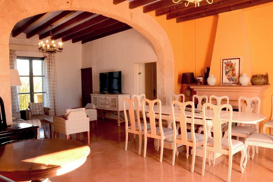 living-dining room for the whole group in large room with  sandstone arch