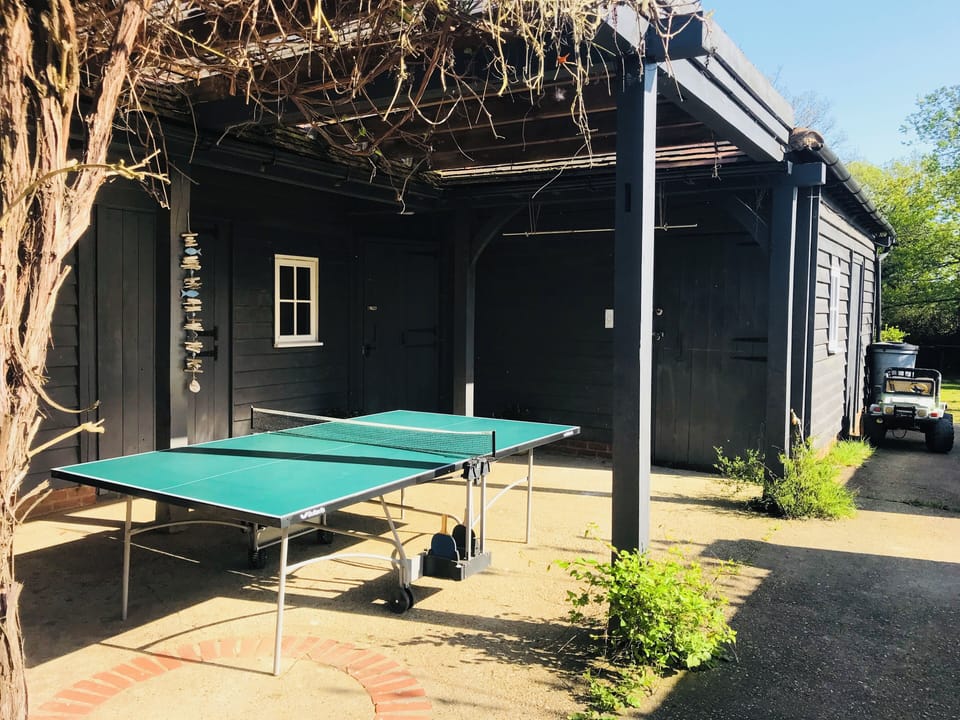 Table tennis under the covered area.