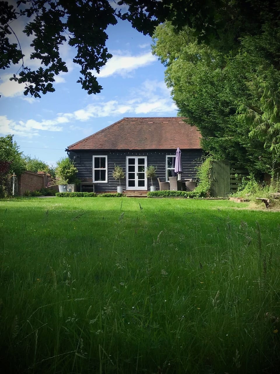 'The Stables' from the end of the large, private, fenced garden.